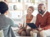 A photo of a happy couple meeting with their portfolio manager